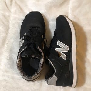 New Balance tennis shoes with snake print